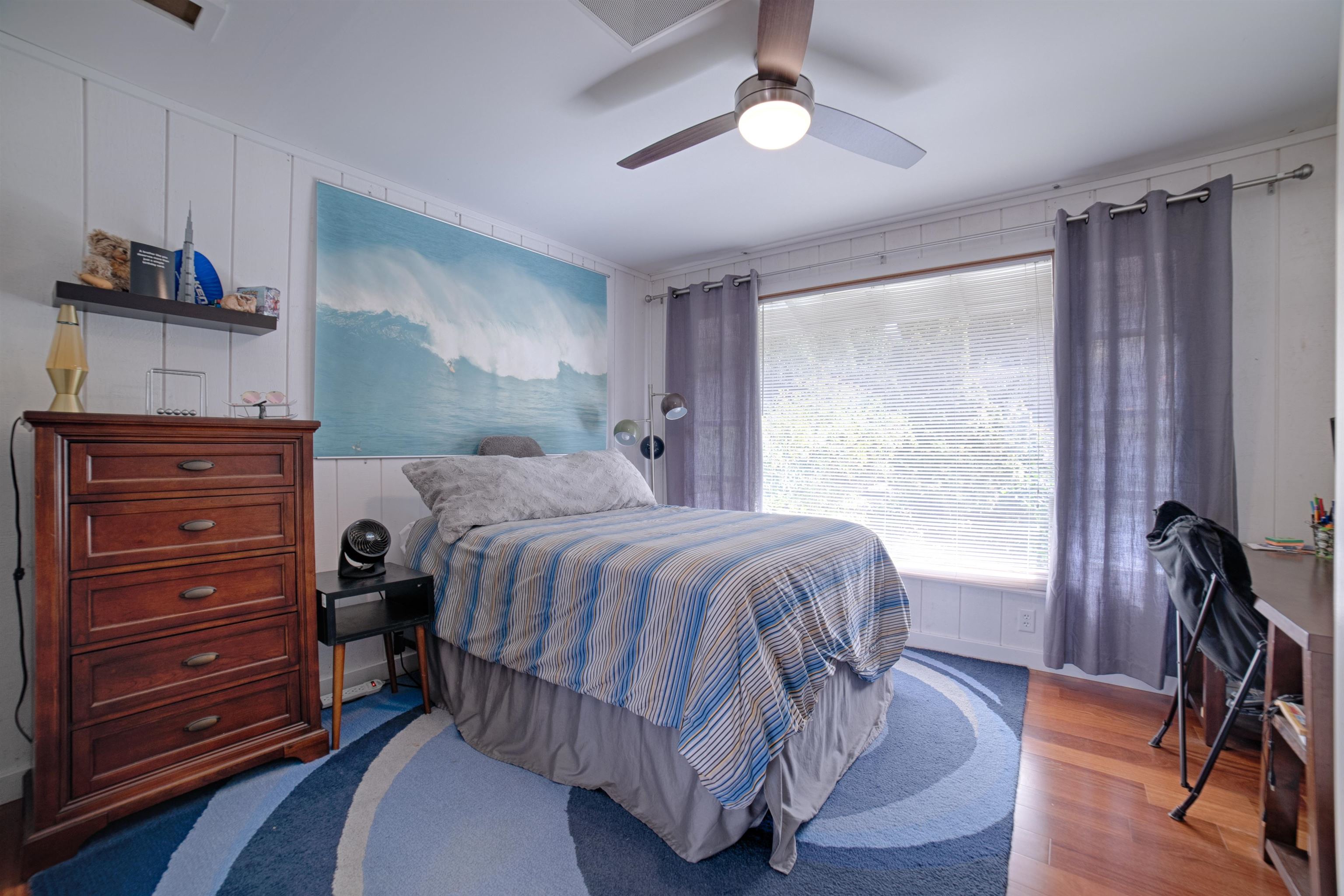 100 A Ihe Place Kula, HI 96790 - Photo 17 of 21 a bedroom with a bed and a dresser