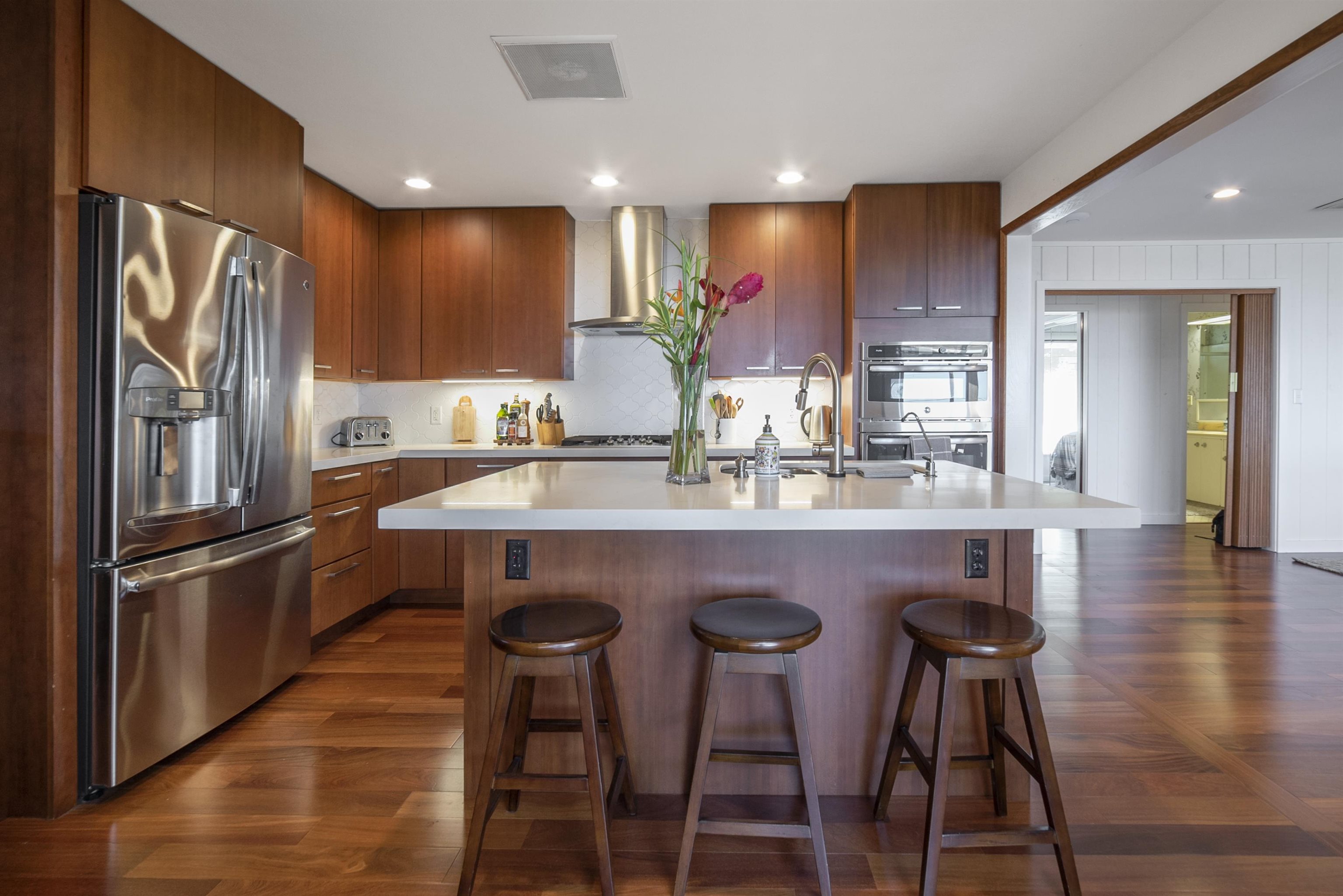 100 A Ihe Place Kula, HI 96790 - Photo 6 of 21 a kitchen with stainless steel appliances granite countertop a refrigerator a sink and a stove