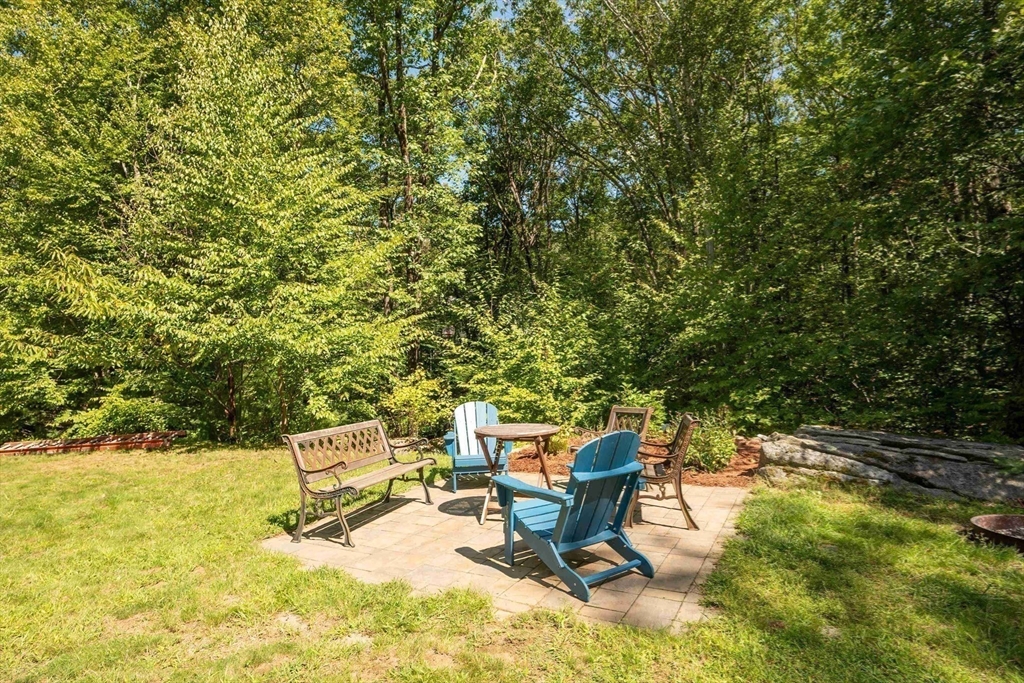 4 Farrar Road Upton, MA 01568 - Photo 12 of 37 a view of a backyard with chair and table