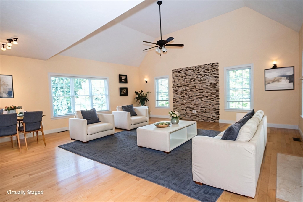 4 Farrar Road Upton, MA 01568 - Photo 13 of 37 a living room with fireplace furniture and a wooden floor