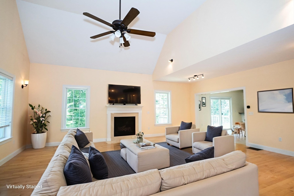 4 Farrar Road Upton, MA 01568 - Photo 14 of 37 a living room with furniture fireplace and a flat screen tv