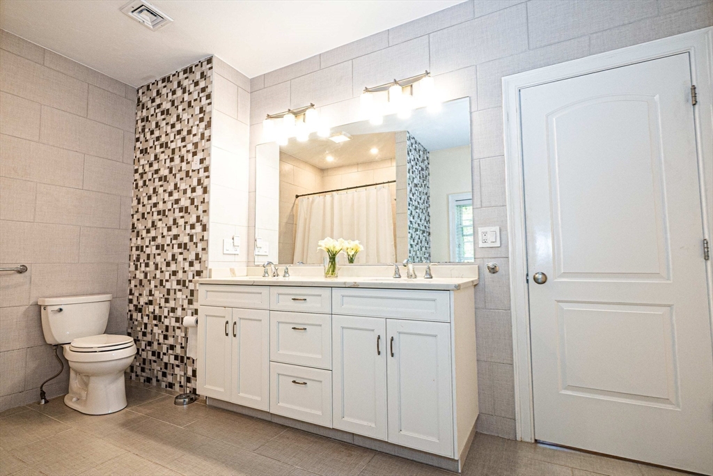 4 Farrar Road Upton, MA 01568 - Photo 20 of 37 a bathroom with a double vanity sink mirror and toilet