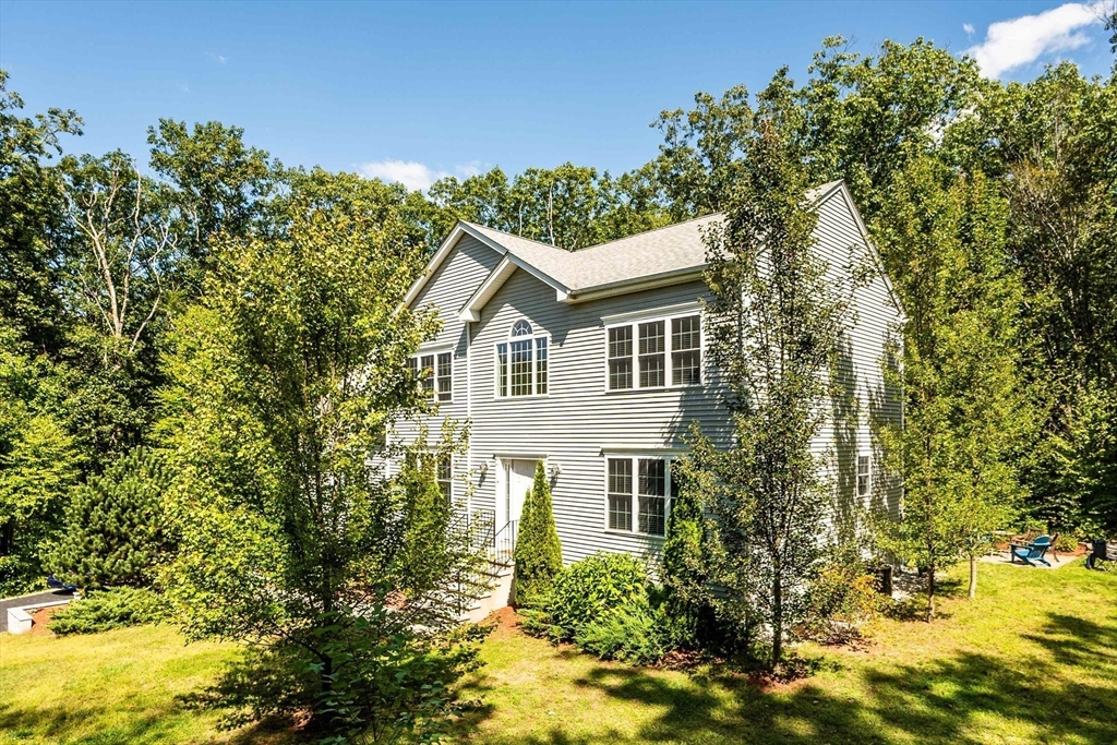 4 Farrar Road Upton, MA 01568 - Photo 2 of 37 a house view with a garden space