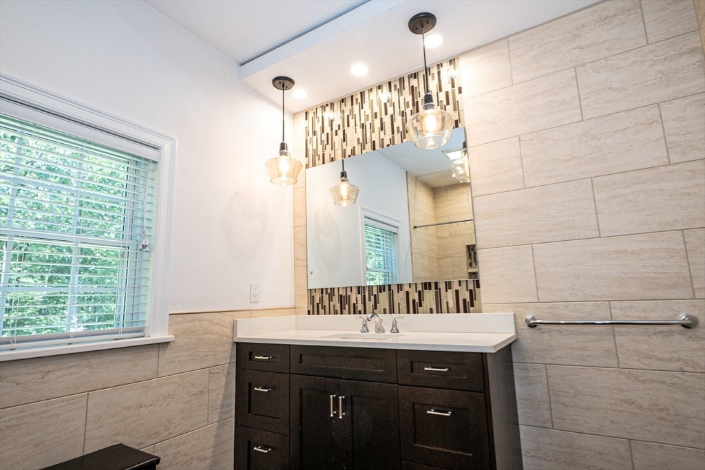 4 Farrar Road Upton, MA 01568 - Photo 23 of 37 a bathroom with a sink and a mirror