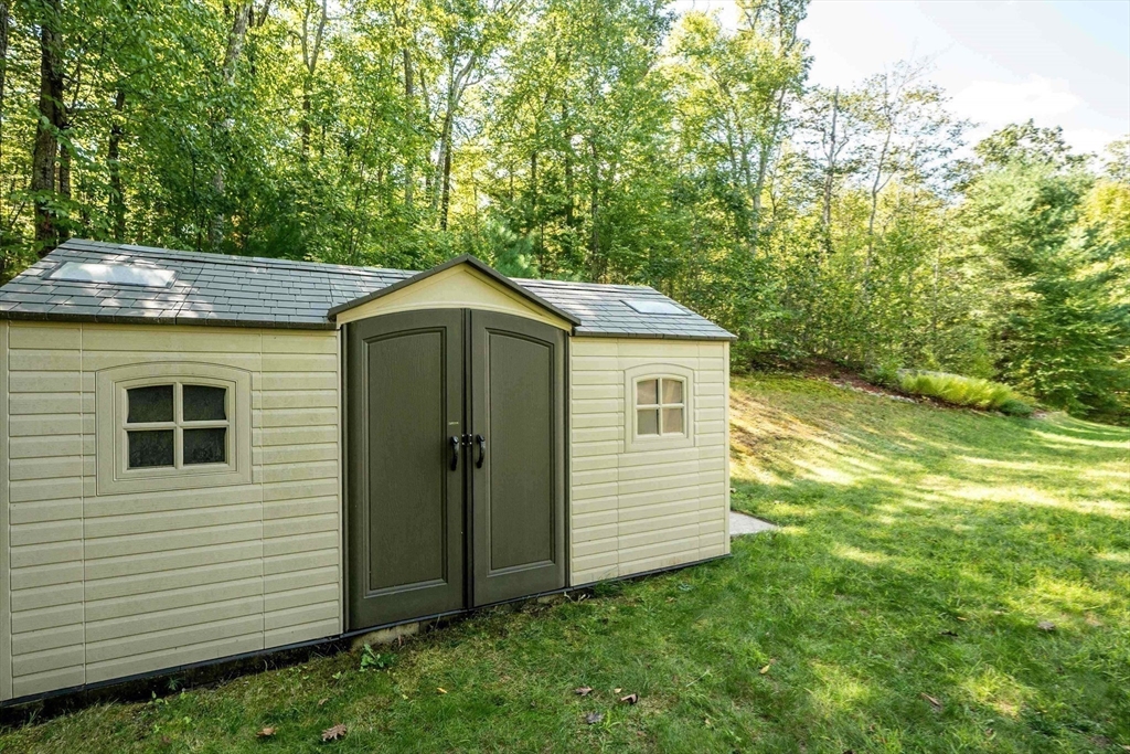 4 Farrar Road Upton, MA 01568 - Photo 29 of 37 a aerial view of a house with yard and trees in the background