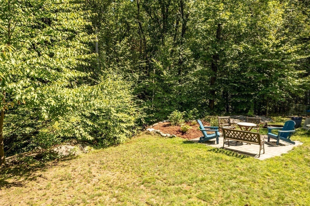 4 Farrar Road Upton, MA 01568 - Photo 30 of 37 a view of a swimming pool with lawn chairs under an umbrella