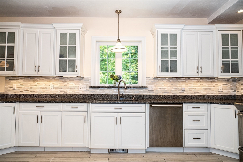 4 Farrar Road Upton, MA 01568 - Photo 3 of 37 a kitchen with granite countertop white cabinets and a window