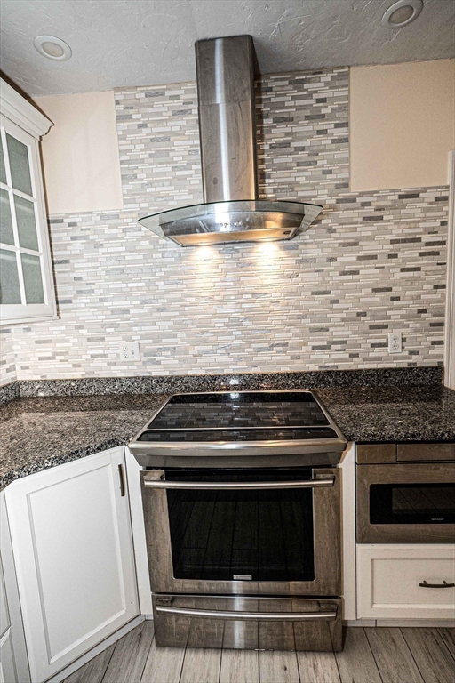 4 Farrar Road Upton, MA 01568 - Photo 8 of 37 a stove top oven sitting inside of a kitchen