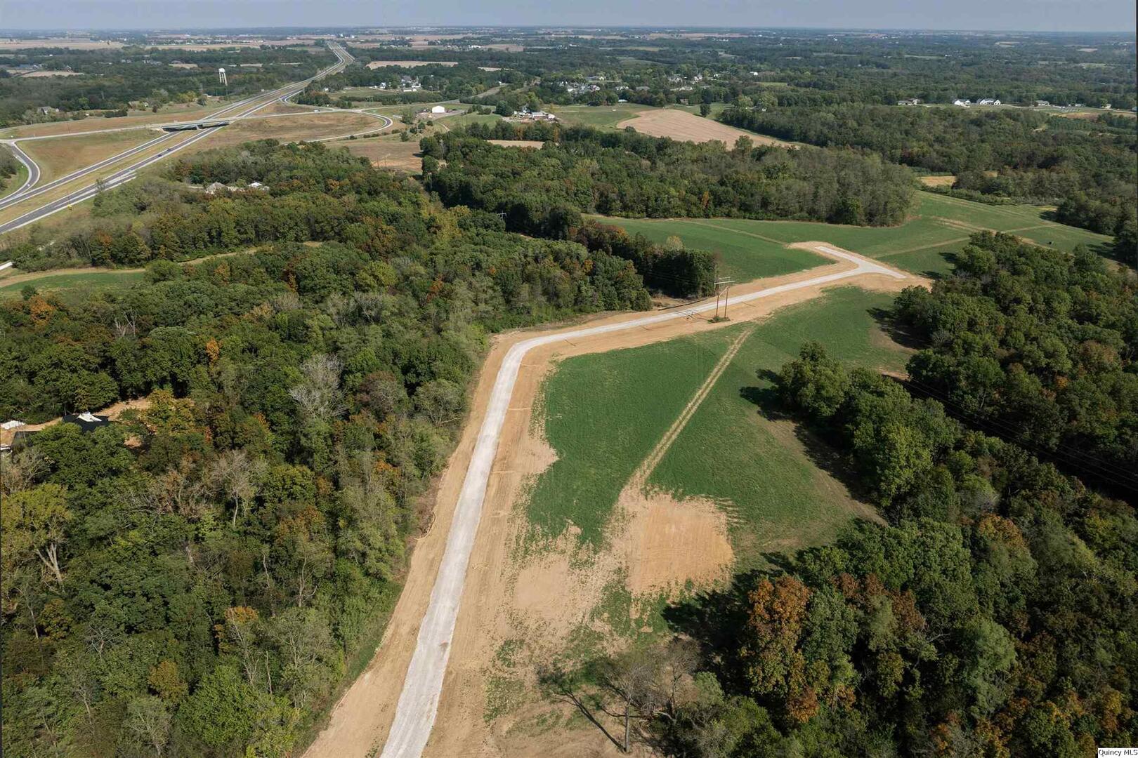 5840 Orchards Edge Lane Quincy, IL 62305 - Photo 4 of 11 an aerial view of a residential houses with outdoor space and mountain view
