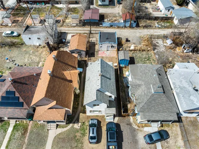 an aerial view of houses with outdoor space