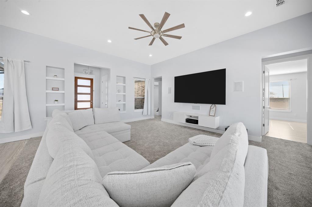 10405 Singleton Road Midlothian, TX 76065 - Photo 6 of 39 Carpeted living room with built in features, a ceiling fan, and recessed lighting