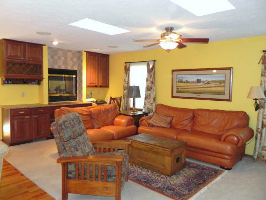563 Baintree Road Lake Summerset, IL 61019 - Photo 4 of 11 a living room with furniture and a chandelier