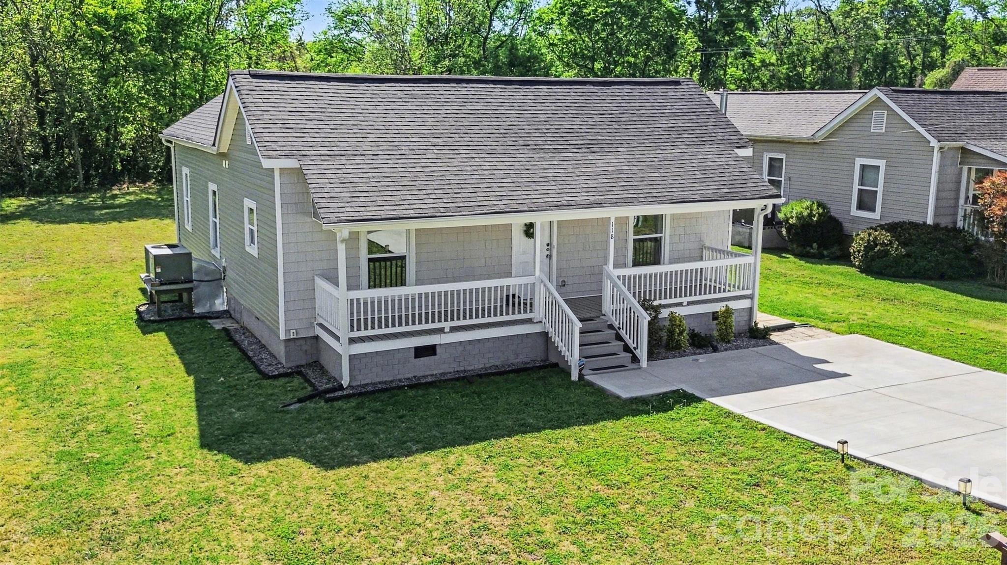 118 Glen Rae Street Southwest Concord, NC 28025 - Photo 1 of 19 a view of a house with a yard and sitting area
