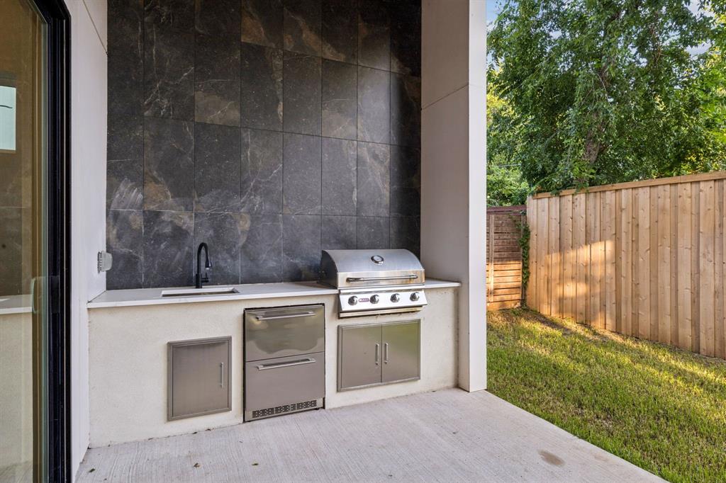 3940 North Cresthaven Road Dallas, TX 75209 - Photo 13 of 24 a stove top oven sitting inside of a kitchen