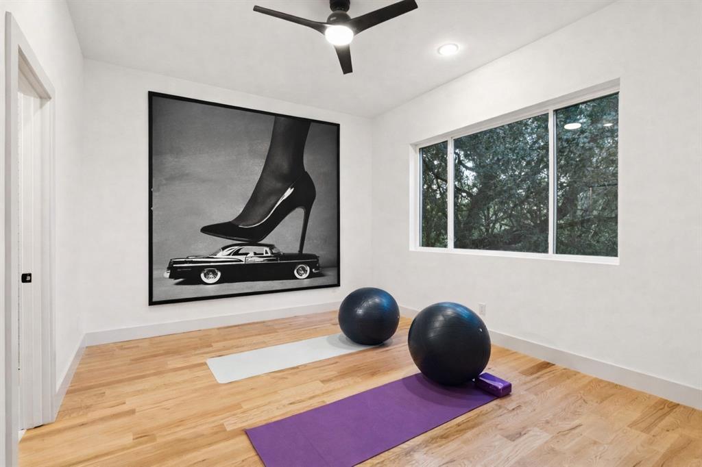 3940 North Cresthaven Road Dallas, TX 75209 - Photo 14 of 24 a living room with a flat screen tv and a wooden floor