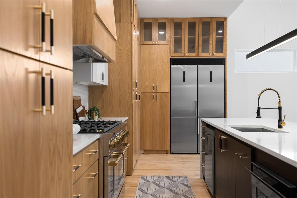3940 North Cresthaven Road Dallas, TX 75209 - Photo 21 of 24 a kitchen with stainless steel appliances granite countertop a sink stove and refrigerator