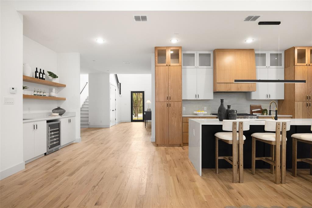 3940 North Cresthaven Road Dallas, TX 75209 - Photo 22 of 24 a kitchen with cabinets and wooden floor
