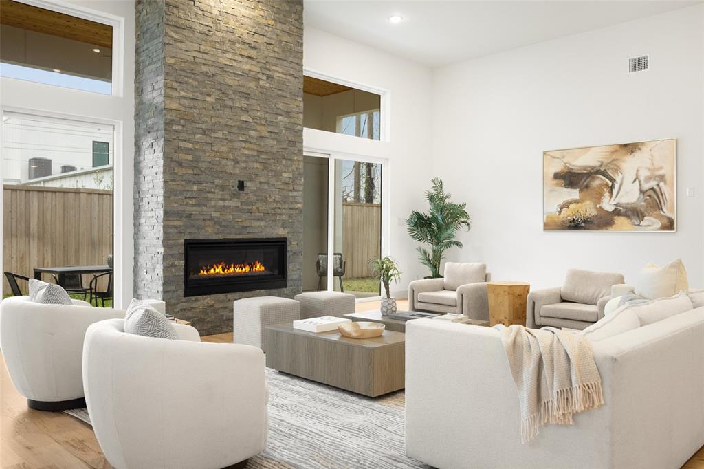 3940 North Cresthaven Road Dallas, TX 75209 - Photo 3 of 24 a living room with furniture and a fireplace