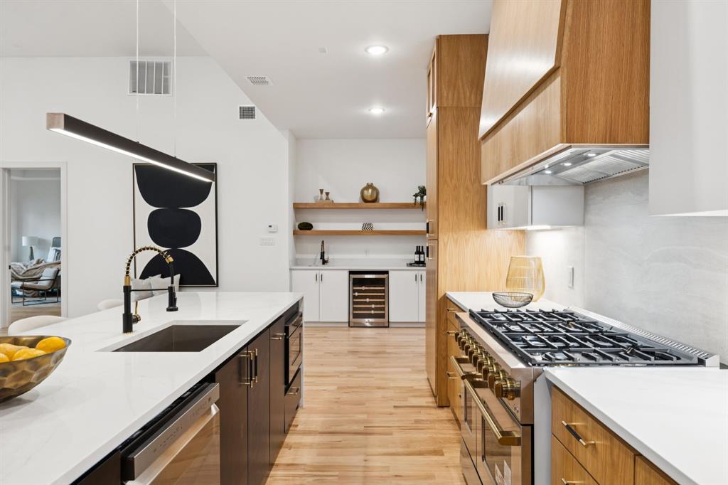 3940 North Cresthaven Road Dallas, TX 75209 - Photo 4 of 24 a kitchen with a stove and a sink