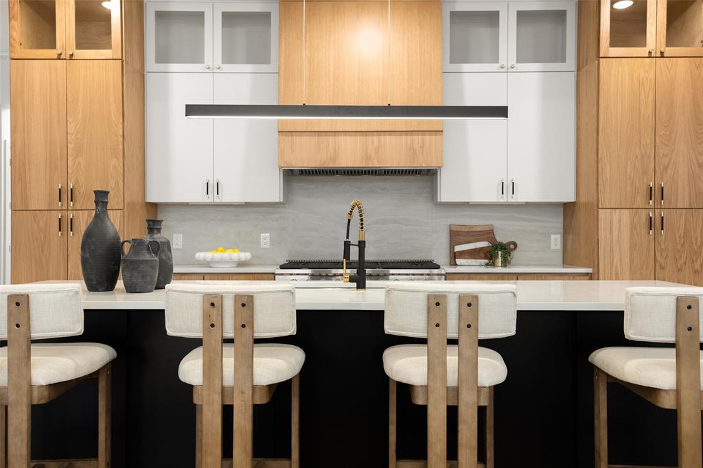 3940 North Cresthaven Road Dallas, TX 75209 - Photo 5 of 24 a kitchen with a sink cabinets and window
