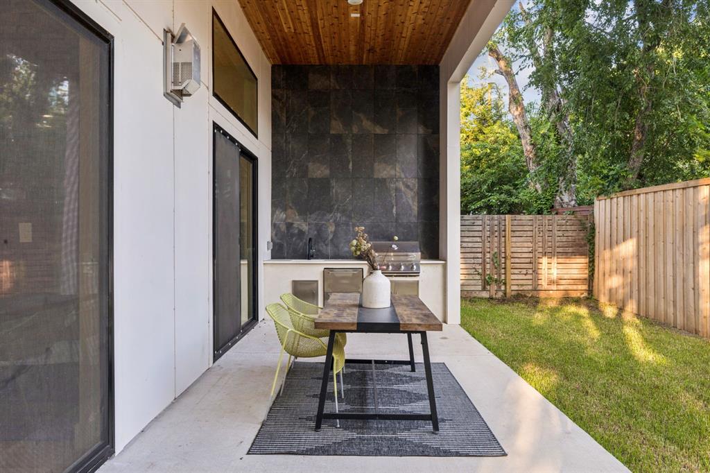 3940 North Cresthaven Road Dallas, TX 75209 - Photo 9 of 24 a patio with table and chairs