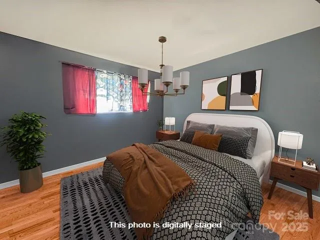 a bedroom with a bed and a potted plant