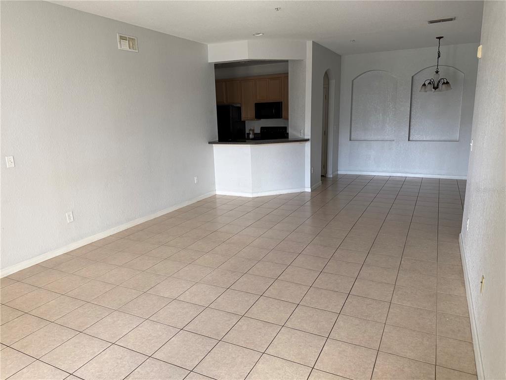 3311 Whitestone Circle, Unit 201 Kissimmee, FL 34741 - Photo 11 of 25 wooden floor in an empty room