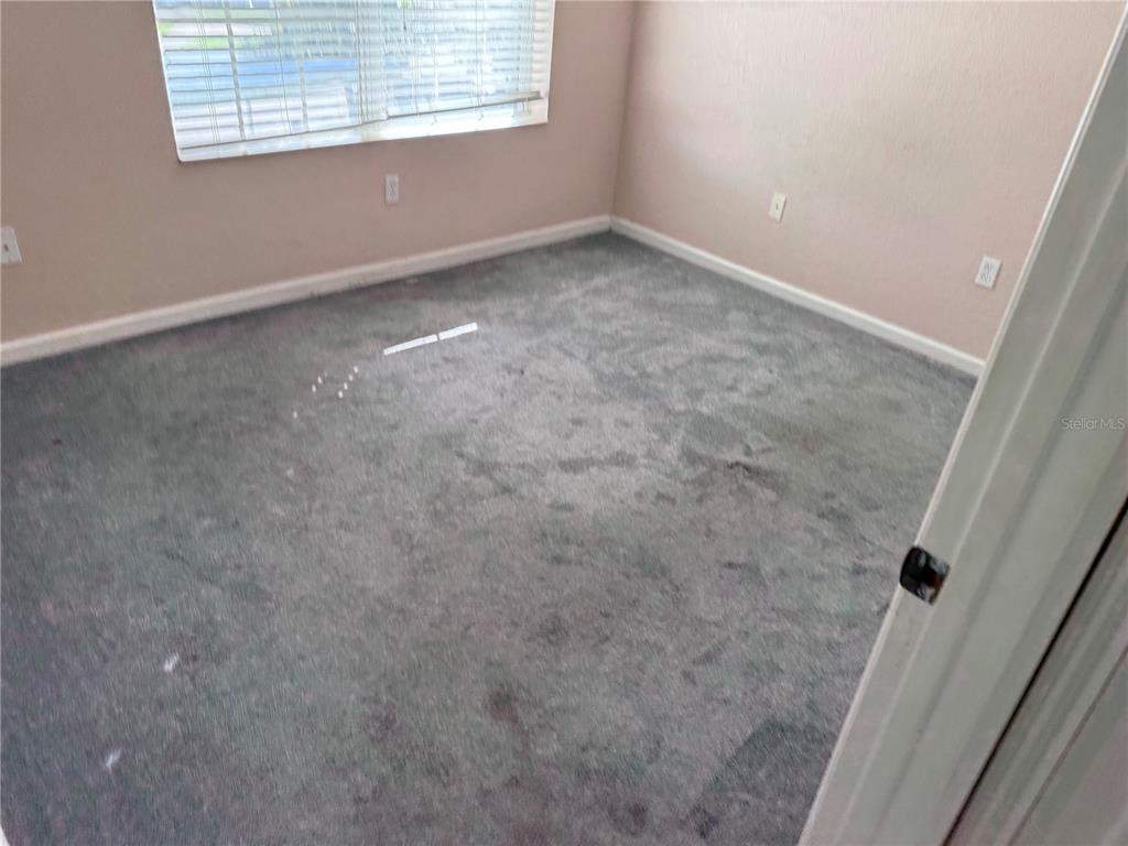 3311 Whitestone Circle, Unit 201 Kissimmee, FL 34741 - Photo 13 of 25 an empty room with windows