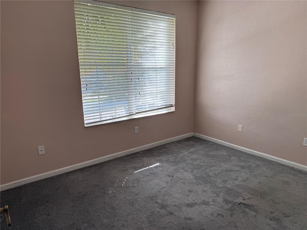 3311 Whitestone Circle, Unit 201 Kissimmee, FL 34741 - Photo 14 of 25 an empty room with a window