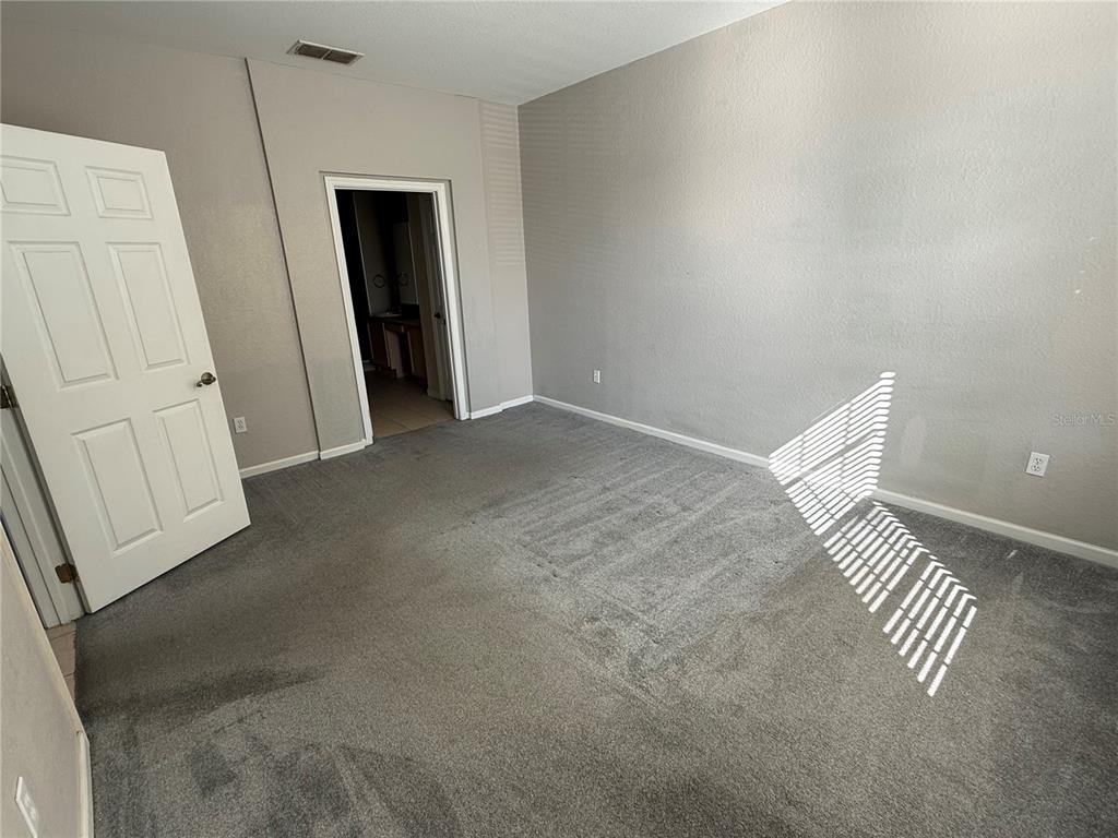 3311 Whitestone Circle, Unit 201 Kissimmee, FL 34741 - Photo 17 of 25 an empty room with windows
