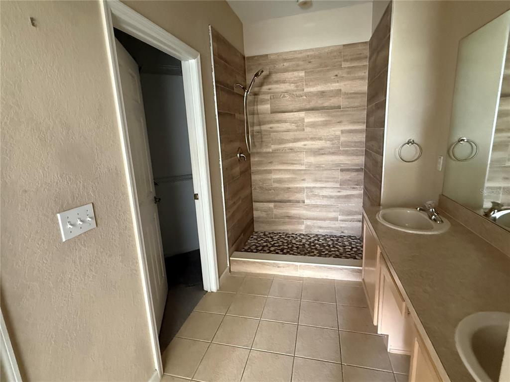 3311 Whitestone Circle, Unit 201 Kissimmee, FL 34741 - Photo 20 of 25 a bathroom with a shower