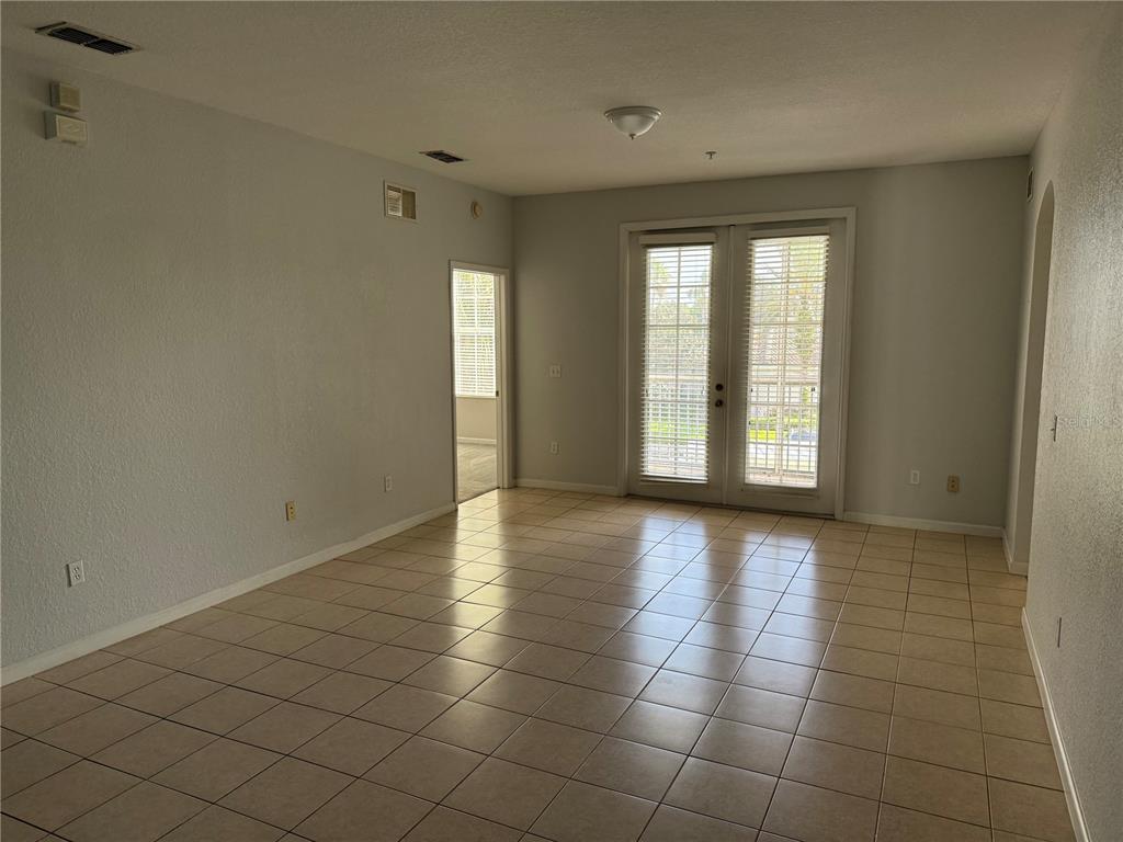 3311 Whitestone Circle, Unit 201 Kissimmee, FL 34741 - Photo 6 of 25 a view of an empty room with a window