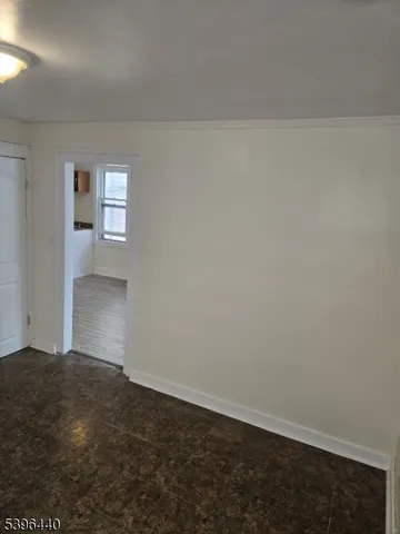 a kitchen with granite countertop a stove and a refrigerator