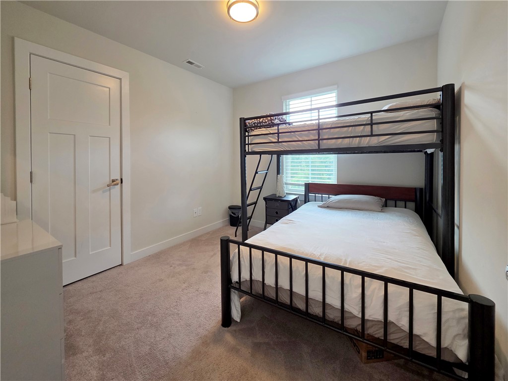 224 Bronson Ridge Anderson, SC 29621 - Photo 14 of 42 A comfortable bedroom features carpet flooring and a built-in window providing natural light.