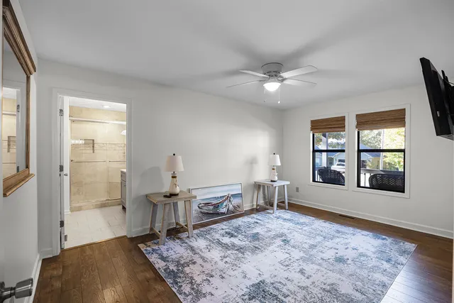 wooden floor with windows and closet in a room