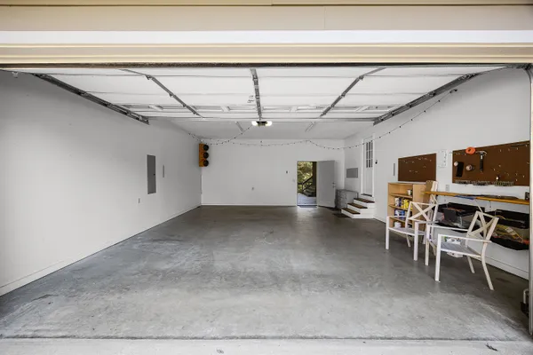 a view of a livingroom with furniture and flat screen tv