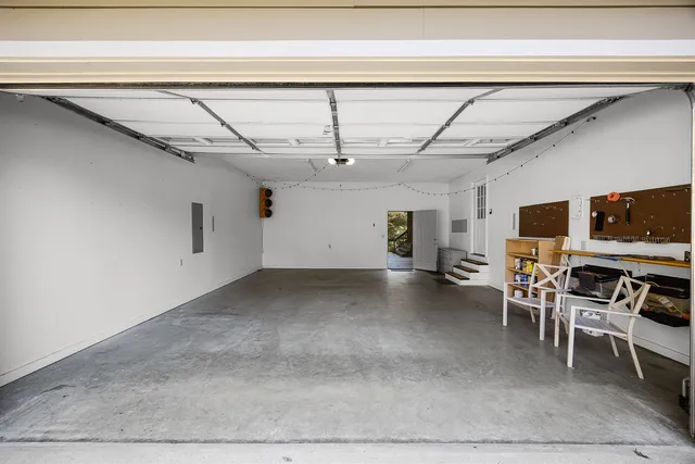 a view of a livingroom with furniture and flat screen tv
