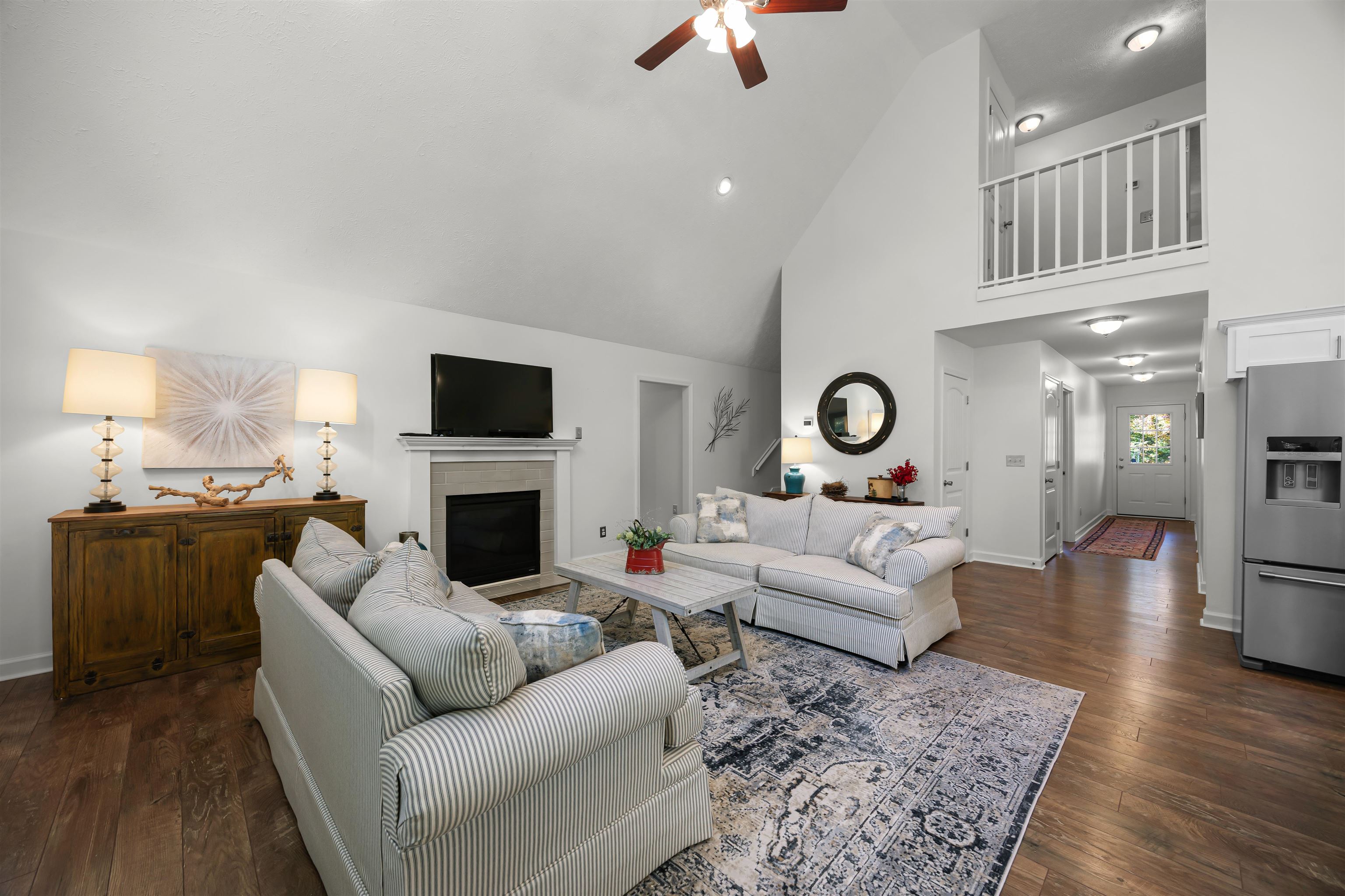 145 Chval Drive Counce, TN 38326 - Photo 4 of 28 a living room with furniture a fireplace and a flat screen tv