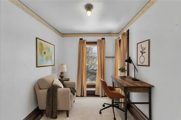 a view of a livingroom with furniture and a window