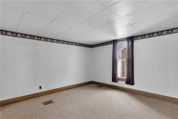 a view of a room with racks on the wall