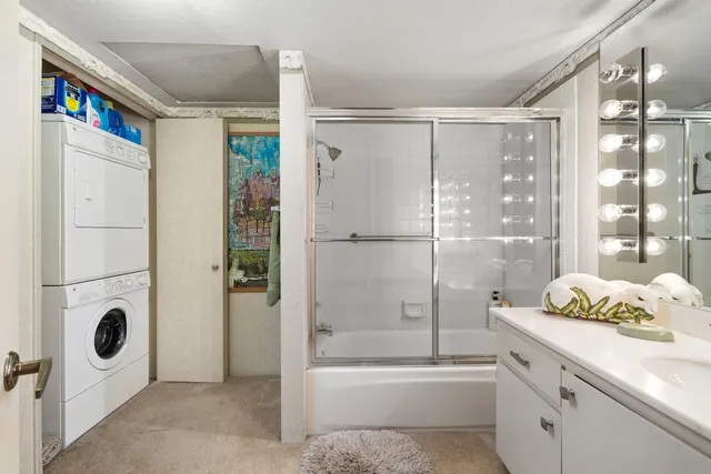 a bathroom with a bathtub shower and mirror