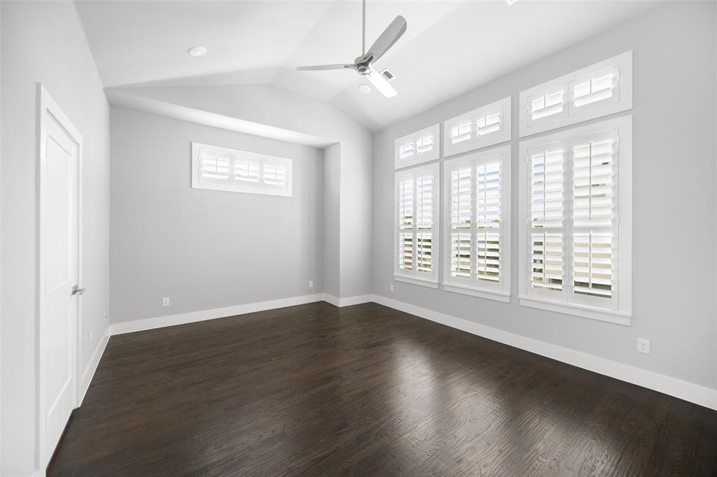 4226 Roseland Avenue, Unit 201 Dallas, TX 75204 - Photo 13 of 24 a view of an empty room with wooden floor and a window
