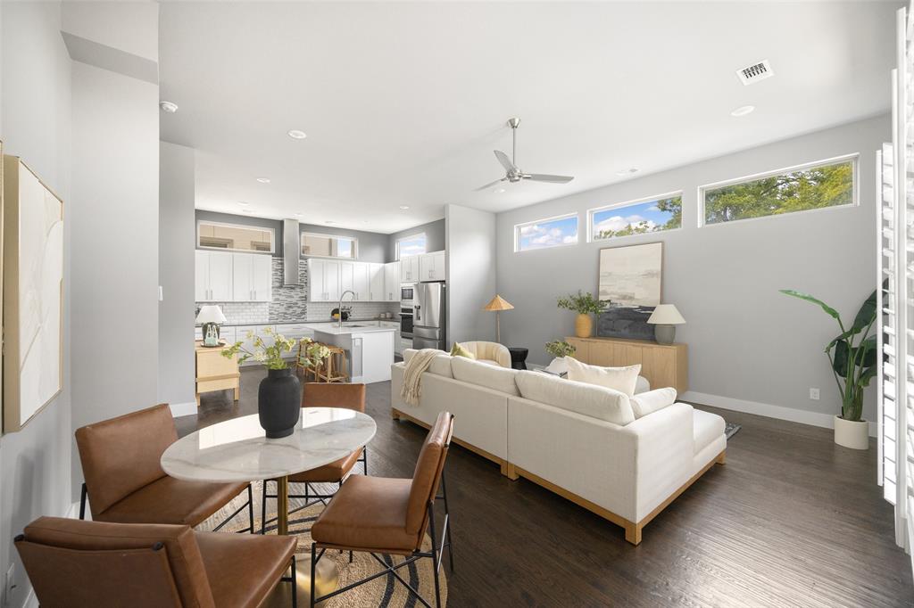 4226 Roseland Avenue, Unit 201 Dallas, TX 75204 - Photo 7 of 24 a living room with furniture and a dining table with wooden floor