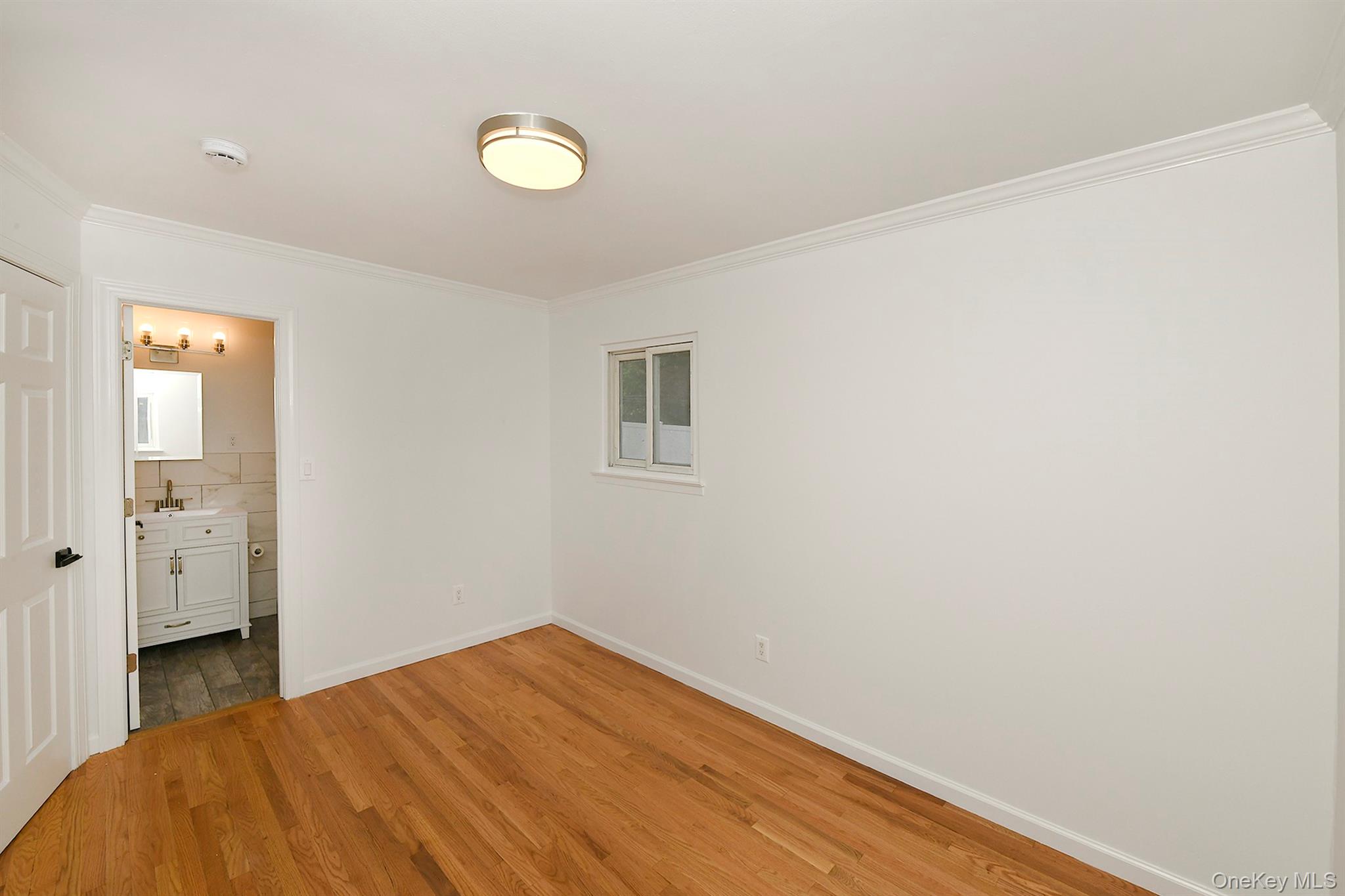 6 Ralph Young Avenue Glen Cove, NY 11542 - Photo 15 of 27 Bedroom with ensuite bathroom