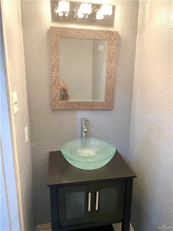 a sink sitting next to a bathroom sink