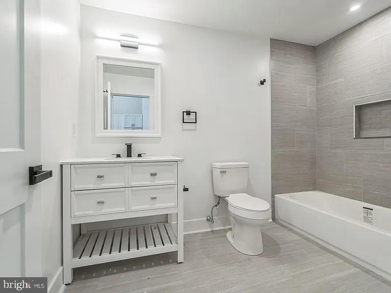 1243 North 26th Street, Unit 4 Philadelphia, PA 19121 - Photo 18 of 18 a bathroom with a toilet sink and a bathtub