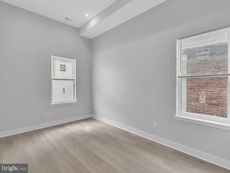 1243 North 26th Street, Unit 4 Philadelphia, PA 19121 - Photo 7 of 18 an empty room with a window