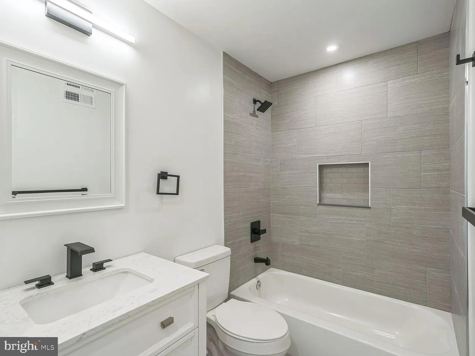 1243 North 26th Street, Unit 4 Philadelphia, PA 19121 - Photo 8 of 18 a bathroom with a sink toilet and shower