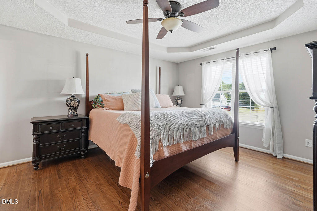 1560 Cane Mill Road Coats, NC 27521 - Photo 21 of 32 a bedroom with a bed and a window