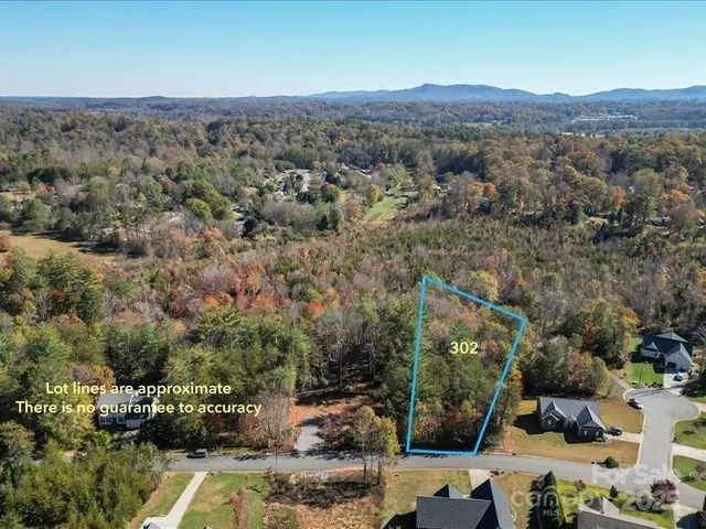 an aerial view of residential house and green space